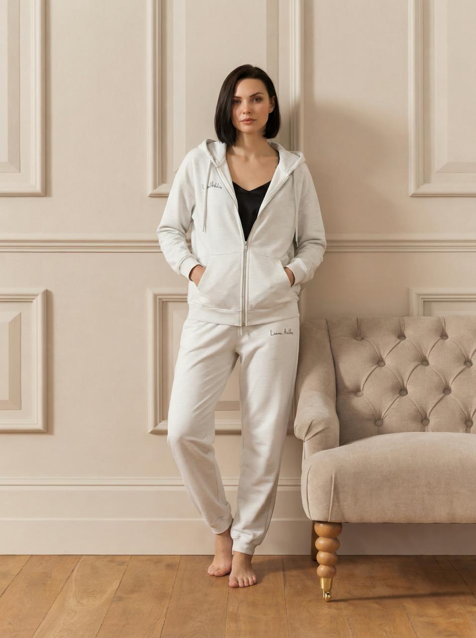 Жіночі брендовані штани-джогери з бежевого меланжевого трикотажу